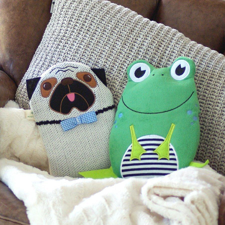 Pug and Frog Eco-Sustainable Hot Water Bottle over beige designer cushion